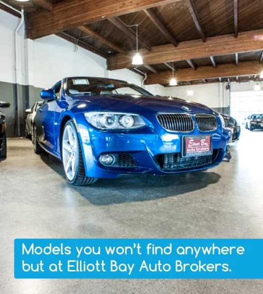 Blue coupe in showroom lighting